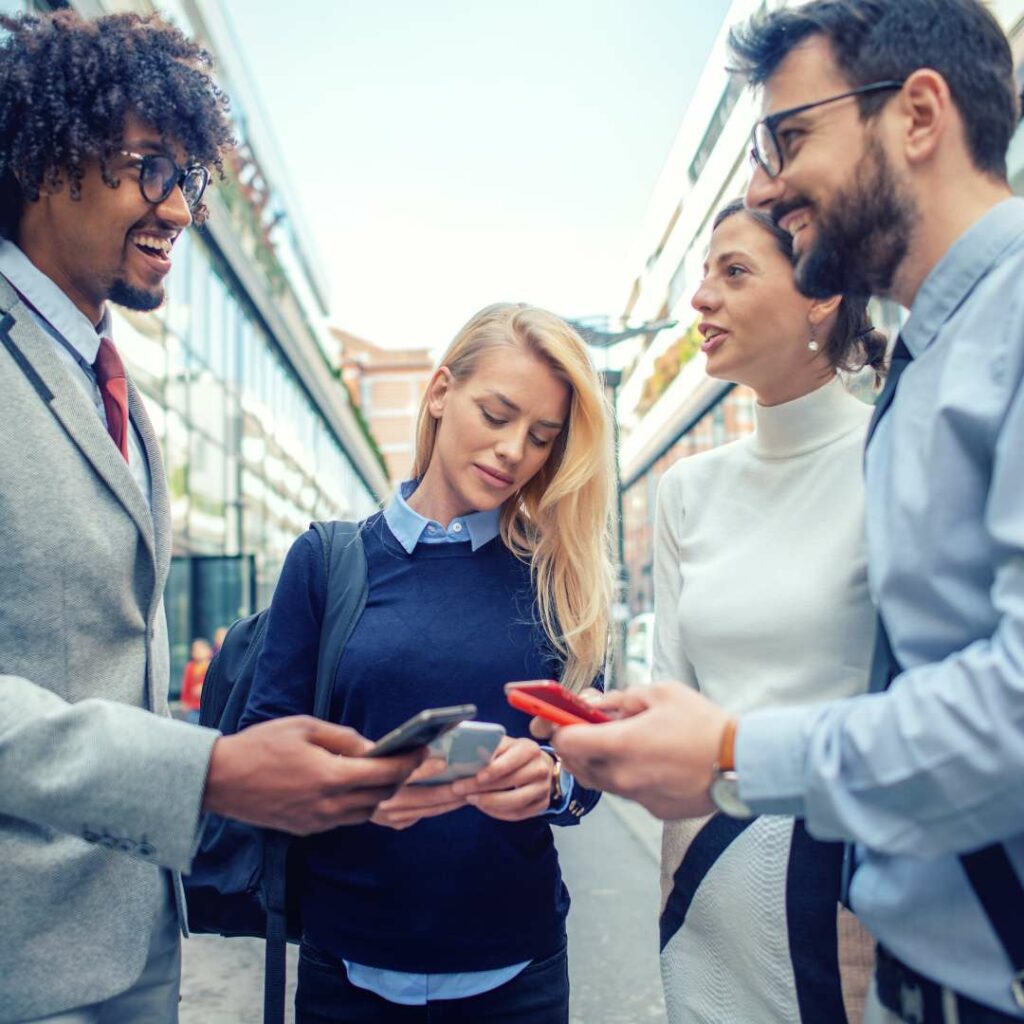 How to Promote Your Small Business Locally | 6 Simple Steps Graphic of several business owners exchanging contact information.